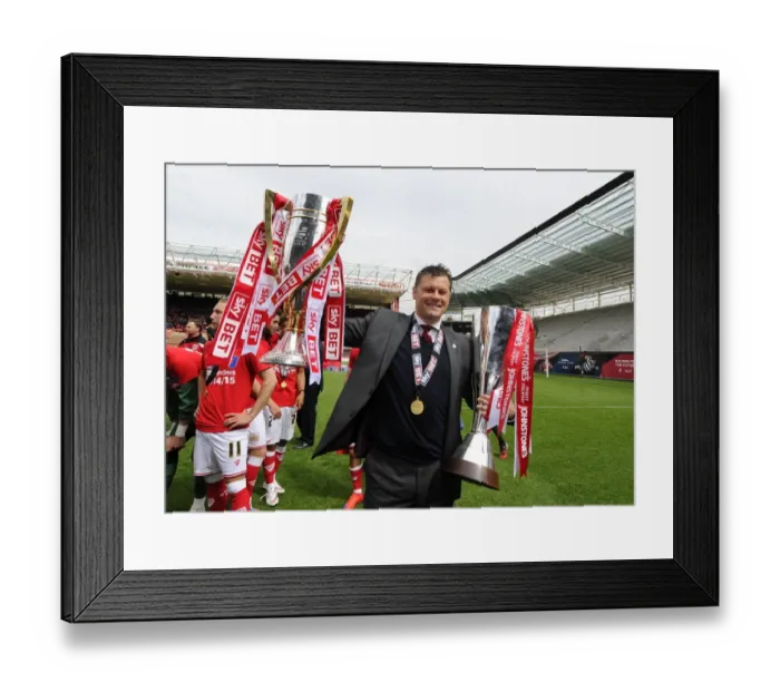 Framed Print : Bristol City's Steve Cotterill Hoists League One and JPT Trophies After Victory Over Walsall