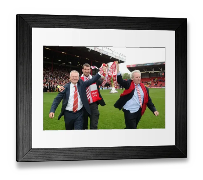 Framed Print : Bristol City Football Club: Steve Lansdown, Jon Lansdown, and Keith Dawe Celebrate Sky Bet League One Victory with the Trophy
