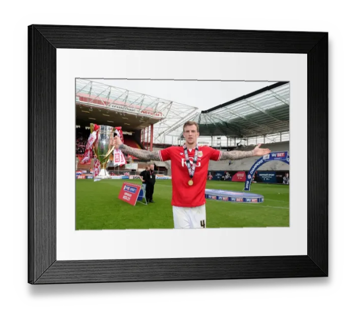 Framed Print : Bristol City Celebrates Promotion to Sky Bet League One with Aden Flint and the Trophy Framed Print : Bristol City Celebrates Promotion to Sky Bet League One with Aden Flint and the Trophy