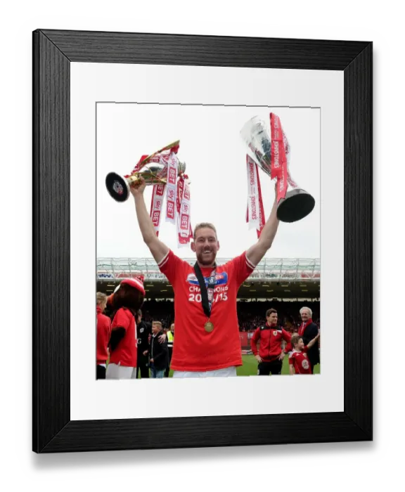 Framed Print : Bristol City's Double Triumph: Scott Wagstaff Celebrates with League One and JPT Trophies at Ashton Gate (May 2015) Framed Print : Bristol City's Double Triumph: Scott Wagstaff Celebrates with League One and JPT Trophies at Ashton Gate (May 2015)