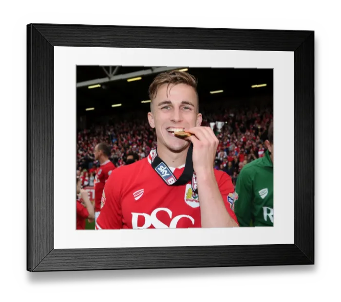 Framed Print : Joe Bryan's Triumph: Biting the Medal after Bristol City's Win over Walsall (May 3, 2015) Framed Print : Joe Bryan's Triumph: Biting the Medal after Bristol City's Win over Walsall (May 3, 2015)