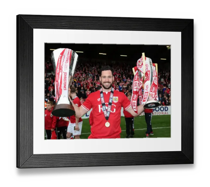Framed Print : Bristol City's Greg Cunningham Lifts Sky Bet League One and JPT Trophies after Winning Double Framed Print : Bristol City's Greg Cunningham Lifts Sky Bet League One and JPT Trophies after Winning Double