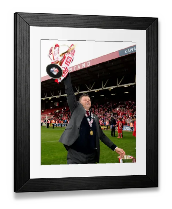 Framed Print : Bristol City's Steve Cotterill Lifts Sky Bet League One and JPT Trophies after Victory over Walsall