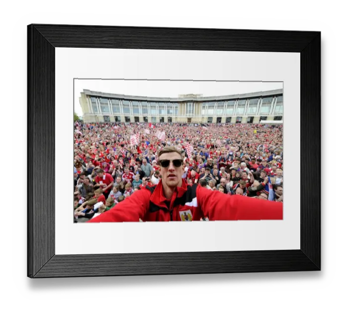 Framed Print : Bristol City Football Club: Aden Flint Amid Thousands of Fans during the Celebration Tour (May 2015) Framed Print : Bristol City Football Club: Aden Flint Amid Thousands of Fans during the Celebration Tour (May 2015)