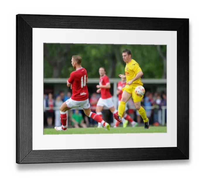 Framed Print : Bristol City's Scott Wagstaff Closes In on Brislington's James Peart During Pre-Season Friendly Framed Print : Bristol City's Scott Wagstaff Closes In on Brislington's James Peart During Pre-Season Friendly
