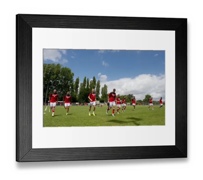 Framed Print : Bristol City Players Warm Up Ahead of Pre-Season Friendly at Brislington Stadium