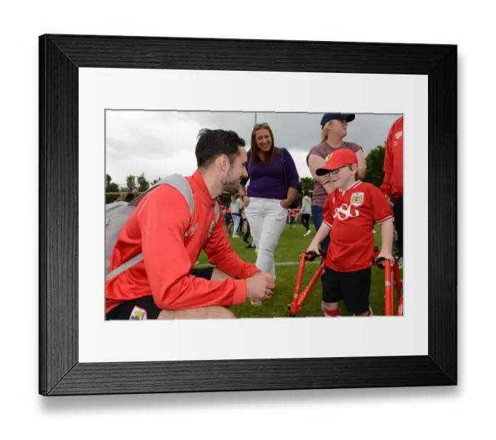 Framed Print : Bristol City FC: Pre-Season Friendly - Greg Cunningham Engages with Young Fan Oskar Pycroft