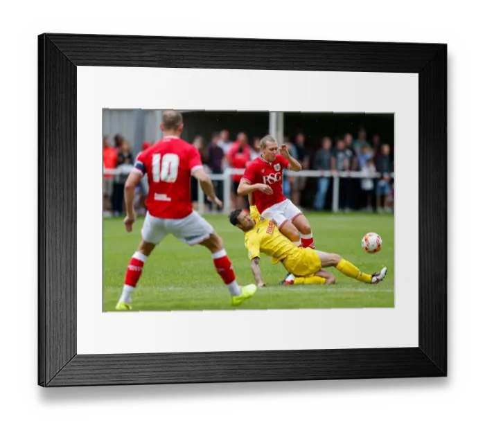 Framed Print : Bristol City FC: Luke Freeman Tackled in Pre-Season Community Match vs. Keynsham Town & Brislington