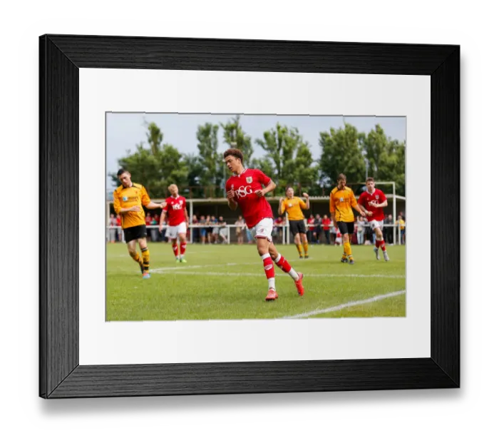 Framed Print : Bristol City's Ash Harper Scores the Winning Goal in Pre-Season Community Match vs. Keynsham Town Framed Print : Bristol City's Ash Harper Scores the Winning Goal in Pre-Season Community Match vs. Keynsham Town