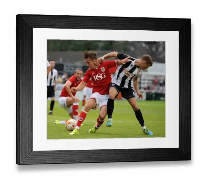 Framed Print : Bristol City's Joe Bryan Clashes with Bath City's Joe McClennan during Pre-Season Friendly at Twerton Park (2015) Framed Print : Bristol City's Joe Bryan Clashes with Bath City's Joe McClennan during Pre-Season Friendly at Twerton Park (2015)