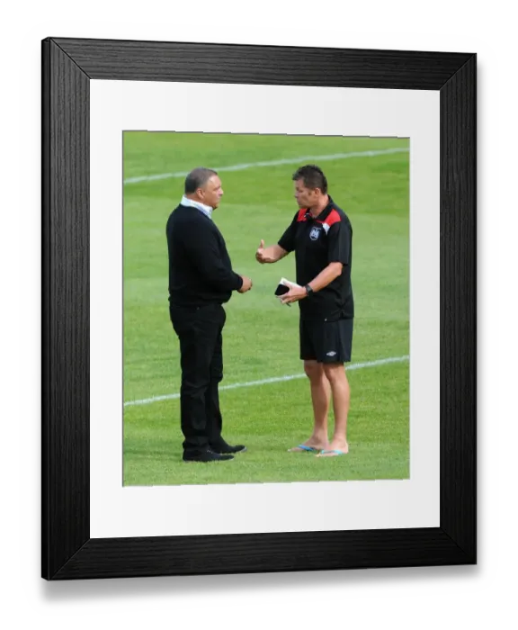 Framed Print : Steve Cotterill Engages with Ernie Arathoon: A Pre-Season Encounter at Twerton Park