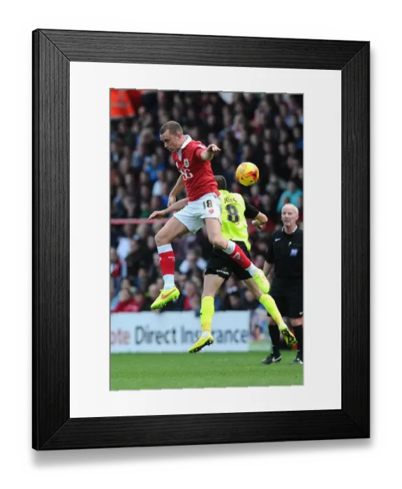 Framed Print : Battling for Supremacy: Wilbraham vs Jones in Bristol City vs Oldham Athletic Football Clash
