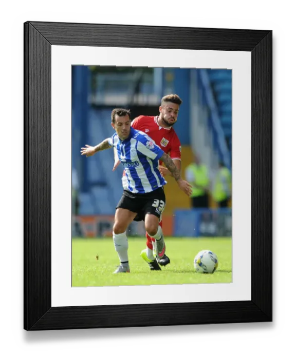 Framed Print : Derrick Williams vs Ross Wallace: Intense Battle for Possession in Sheffield Wednesday vs Bristol City Championship Clash