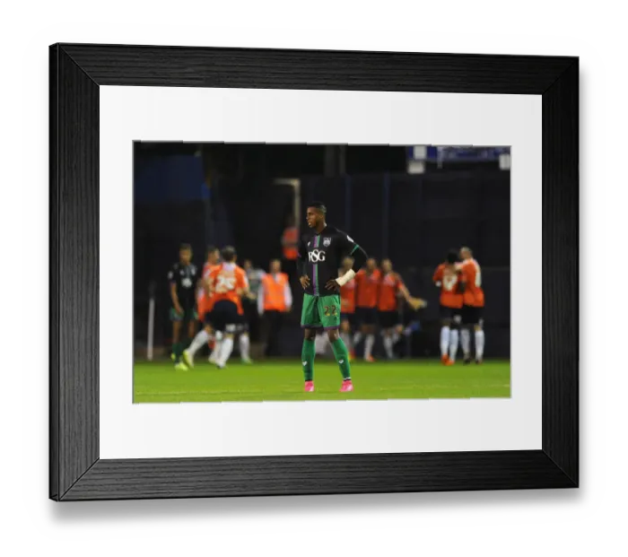 Framed Print : Jonathan Kodjia's Disappointment: Luton Town Celebrates After Eliminating Bristol City