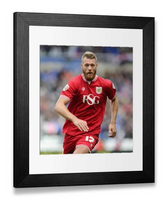 Framed Print : Bristol City's Nathan Baker Faces Off Against Birmingham City in Championship Clash Framed Print : Bristol City's Nathan Baker Faces Off Against Birmingham City in Championship Clash