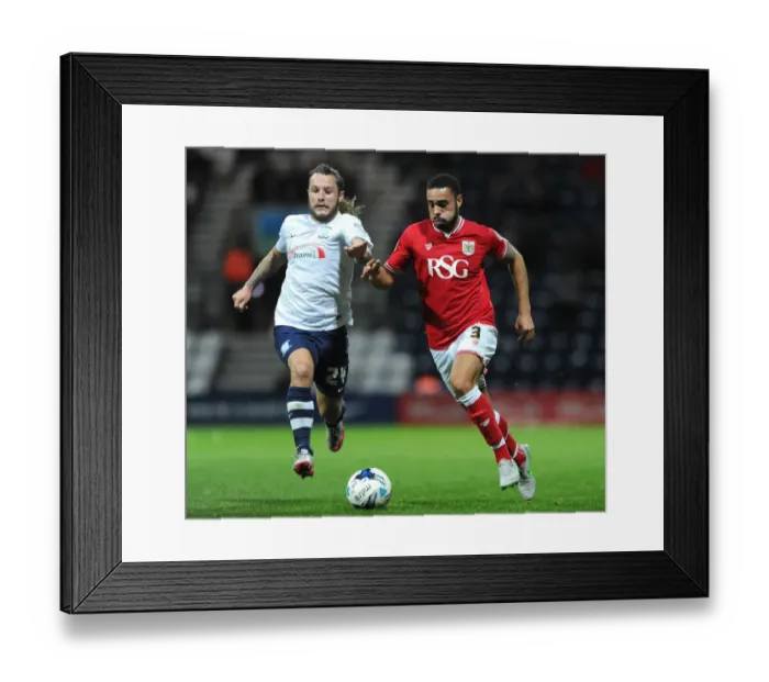 Framed Print : Chasing Glory: Derrick Williams vs. Stevie May at Deepdale Stadium Framed Print : Chasing Glory: Derrick Williams vs. Stevie May at Deepdale Stadium