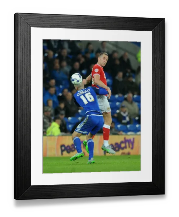 Framed Print : Aaron Wilbraham vs Matthew Connolly: Intense Aerial Battle at Cardiff City Stadium, 2015 Framed Print : Aaron Wilbraham vs Matthew Connolly: Intense Aerial Battle at Cardiff City Stadium, 2015