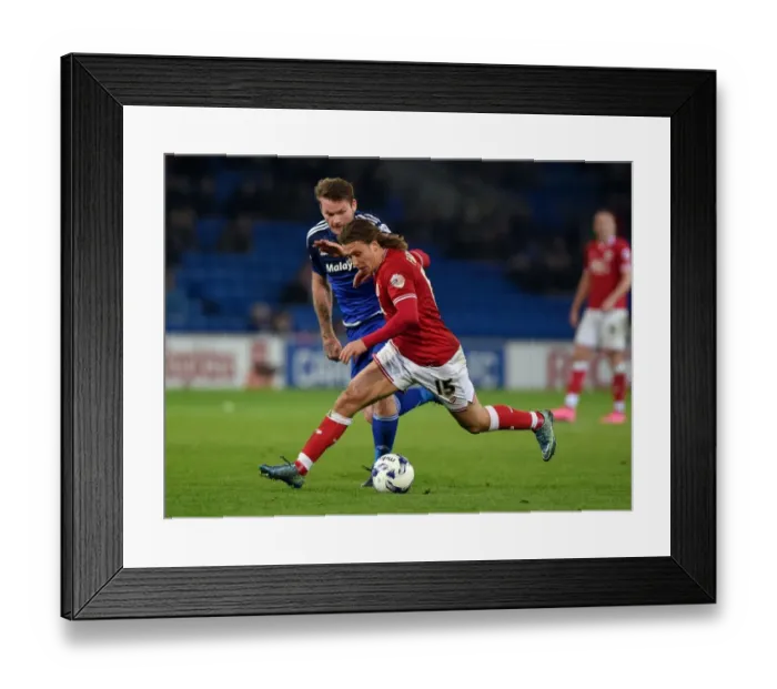 Framed Print : Battling for Supremacy: Luke Freeman vs. Aron Gunnarsson in Cardiff City vs. Bristol City Championship Clash
