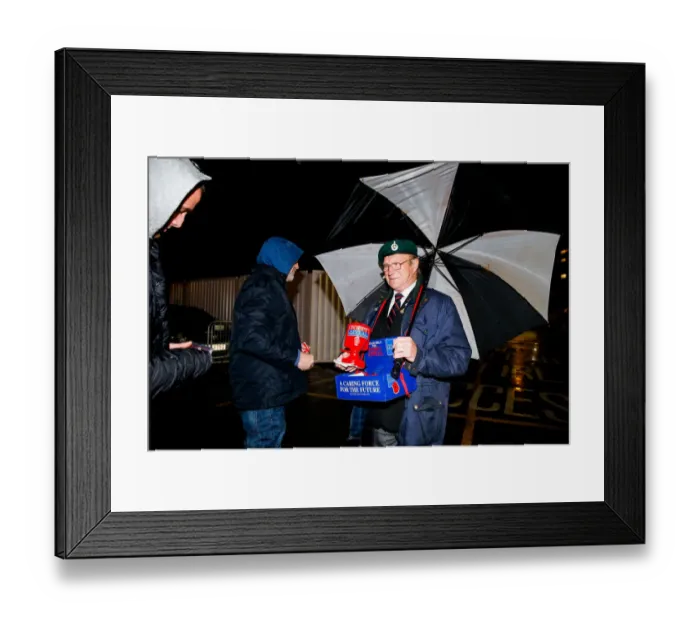 Framed Print : Bristol City's Buster Footman Braves the Rain for Poppy Appeal Donations at Ashton Gate Stadium Framed Print : Bristol City's Buster Footman Braves the Rain for Poppy Appeal Donations at Ashton Gate Stadium