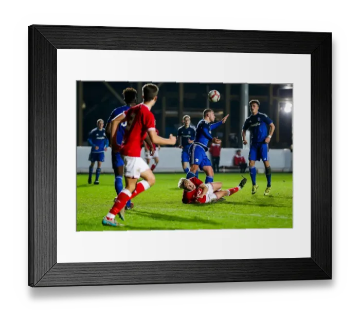 Framed Print : Bristol City U18 vs Cardiff City U18: Jake Andrews Dramatic Fall at Ashton Gate Stadium Framed Print : Bristol City U18 vs Cardiff City U18: Jake Andrews Dramatic Fall at Ashton Gate Stadium