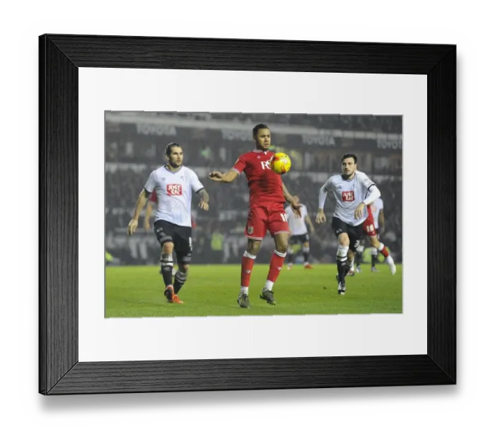Framed Print : Bristol City's Liam Moore Battles for Control in Derby County Showdown
