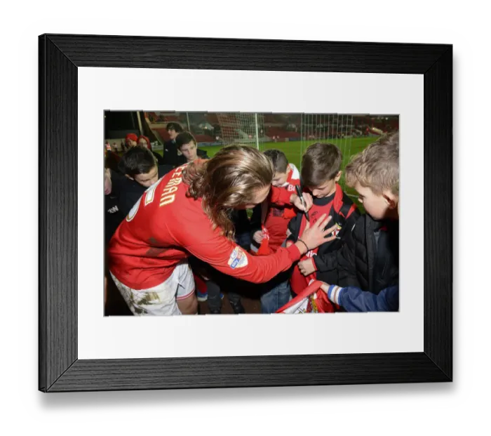 Framed Print : Bristol City's Luke Freeman Signs Autographs for Fans after Championship Match against QPR Framed Print : Bristol City's Luke Freeman Signs Autographs for Fans after Championship Match against QPR