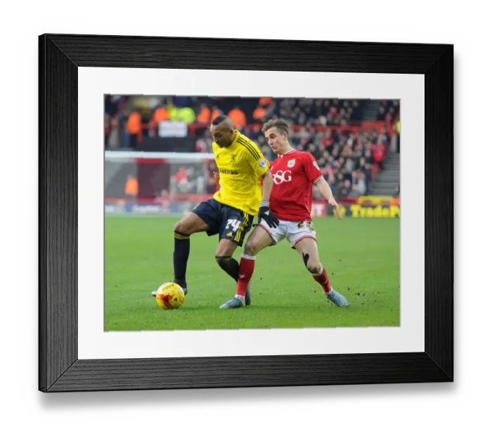 Framed Print : Battling for Supremacy: Joe Bryan vs. Emilio Nsue in the Bristol City vs. Middlesbrough Championship Clash
