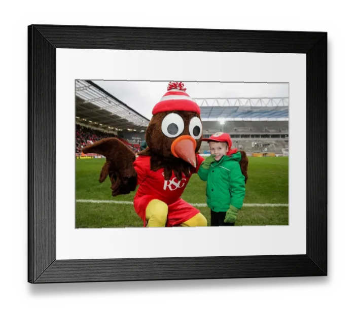 Framed Print : Bristol City's Scrumpy Mascot Surprises Young Fan with Cap at Half-Time