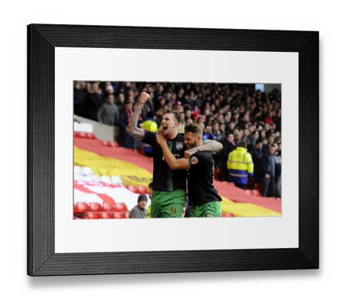 Framed Print : Jubilant Moment: Aden Flint and Nathan Baker's Euphoric Celebration after Bristol City's Win at Nottingham Forest (2016)