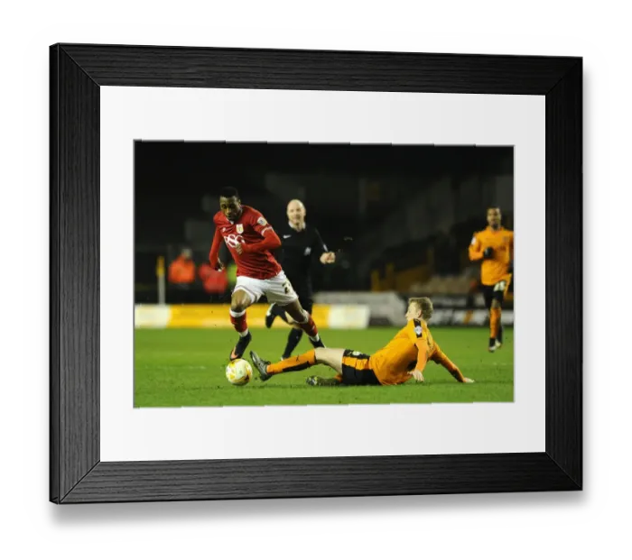 Framed Print : Avoiding a Tackle: Kodjia Eves Dangerously Past Saville in Wolves vs. Bristol City Clash