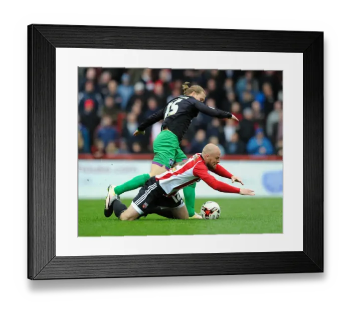 Framed Print : Brentford vs. Bristol City: Luke Freeman Fouls Alan McCormack Framed Print : Brentford vs. Bristol City: Luke Freeman Fouls Alan McCormack