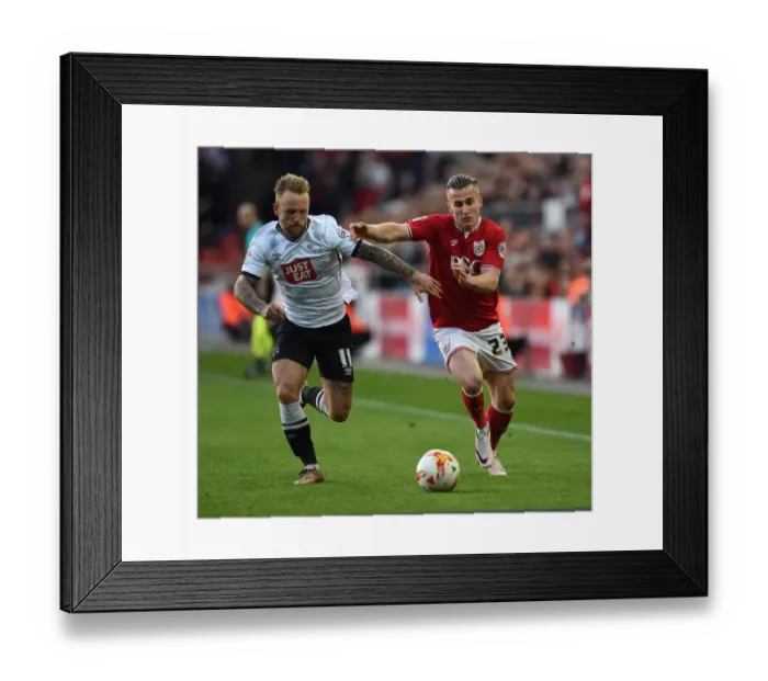 Framed Print : Bristol City's Joe Bryan Fends Off Derby County's Johnny Russell in Championship Clash