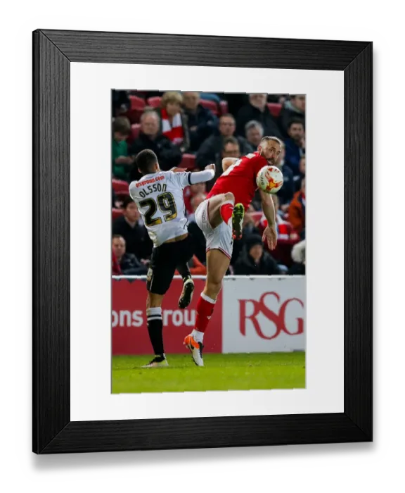 Framed Print : Intense Rivalry: Wilbraham vs. Olsson Clash at Ashton Gate