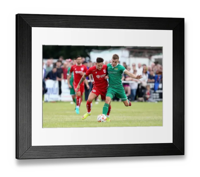 Framed Print : Bristol City's Josh Brownhill Faces Off Against Hengrove Athletic's Craig White in Pre-Season Friendly Framed Print : Bristol City's Josh Brownhill Faces Off Against Hengrove Athletic's Craig White in Pre-Season Friendly