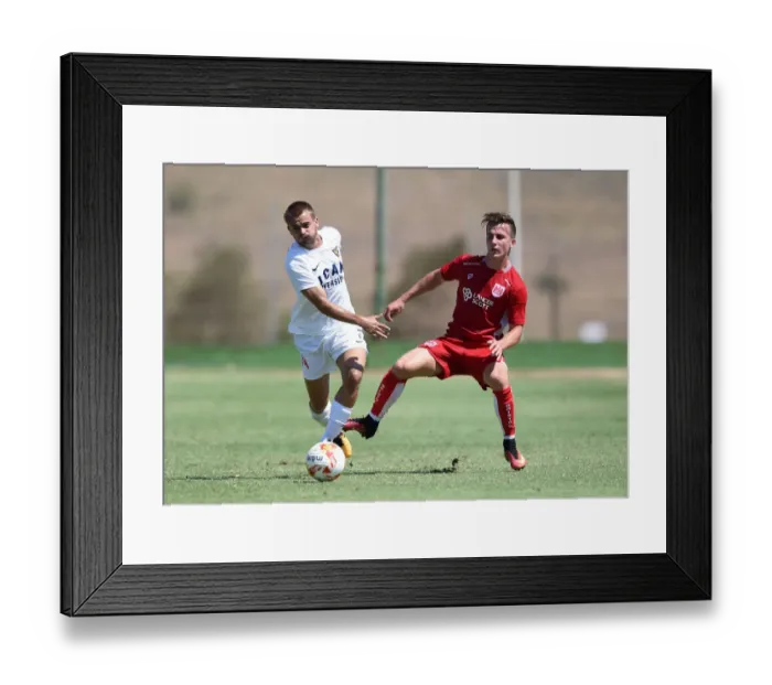 Framed Print : Bristol City's Joe Bryan in Action: Tussling for the Ball during Pre-season Friendly at La Manga Framed Print : Bristol City's Joe Bryan in Action: Tussling for the Ball during Pre-season Friendly at La Manga