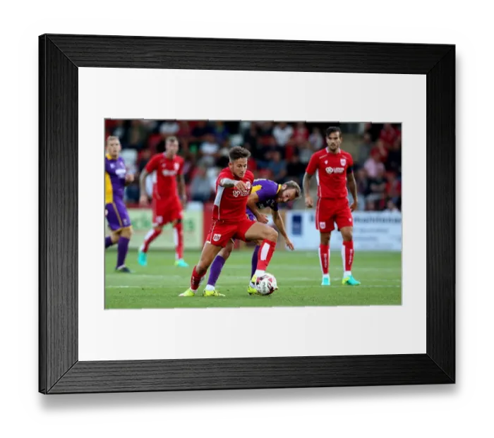 Framed Print : Bristol City's Josh Brownhill Outmaneuvers Cheltenham Town's James Dayton in Preseason Friendly Framed Print : Bristol City's Josh Brownhill Outmaneuvers Cheltenham Town's James Dayton in Preseason Friendly