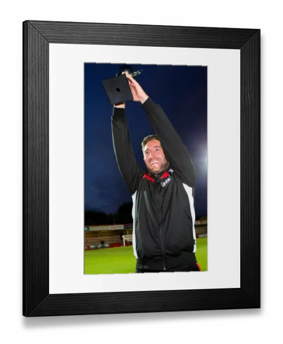 Framed Print : Johnson Family Rivalry: Lee Lifts the Trophy Over Father Gary's Cheltenham Team