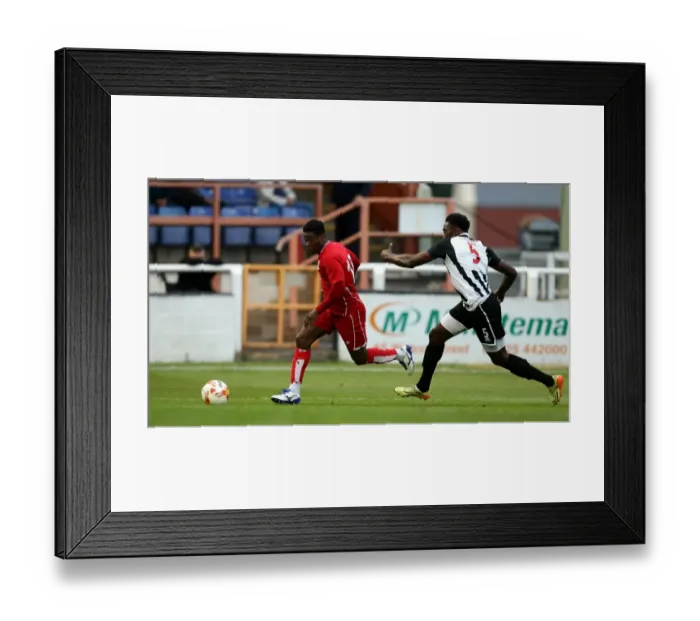 Framed Print : Kieran Agard Surges Past Bath City's Manny Monthe in Pre-Season Friendly
