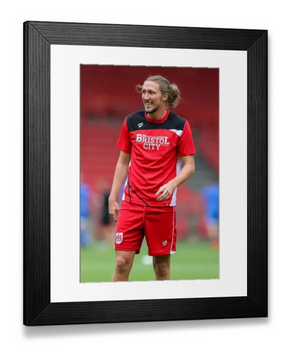 Framed Print : Luke Ayling's Intense Concentration: Bristol City vs Portsmouth Pre-Season Friendly