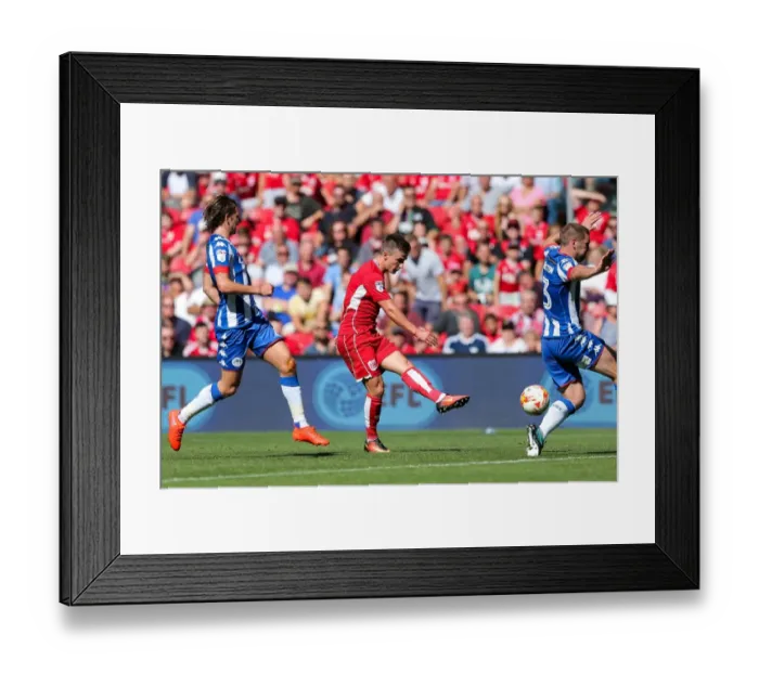 Framed Print : Bristol City's Joe Bryan Scores Past Wigan Athletic's Jake Buxton at Ashton Gate Stadium Framed Print : Bristol City's Joe Bryan Scores Past Wigan Athletic's Jake Buxton at Ashton Gate Stadium