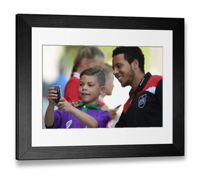 Framed Print : Bristol City's Korey Smith and Young Fan Share a Moment at Ashton Gate Framed Print : Bristol City's Korey Smith and Young Fan Share a Moment at Ashton Gate