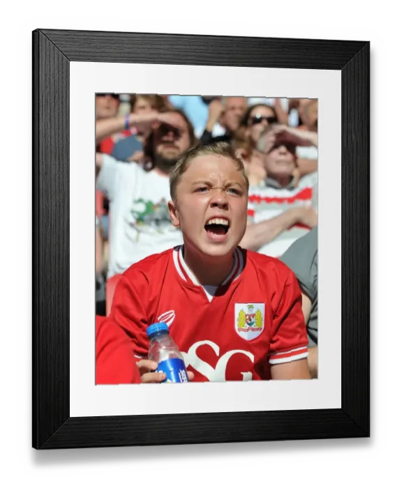 Framed Print : A Passionate Bristol City Fan Cheers in the Dolman Stand during the Sky Bet Championship Match against Wigan Athletic Framed Print : A Passionate Bristol City Fan Cheers in the Dolman Stand during the Sky Bet Championship Match against Wigan Athletic