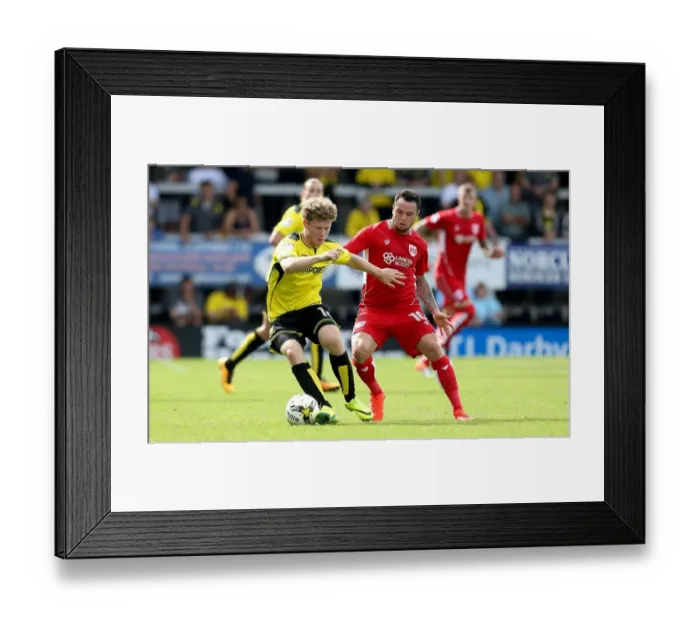 Framed Print : Bristol City's Lee Tomlin Tackled by Burton Albion's Matt Palmer during Sky Bet Championship Match Framed Print : Bristol City's Lee Tomlin Tackled by Burton Albion's Matt Palmer during Sky Bet Championship Match