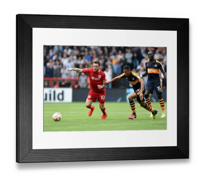 Framed Print : A Battle for Possession: Lee Tomlin vs Isaac Hayden Framed Print : A Battle for Possession: Lee Tomlin vs Isaac Hayden