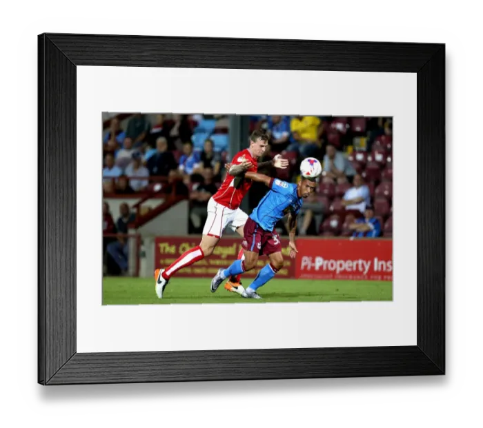 Framed Print : Aden Flint vs Jordan Clarke: Intense Battle for Ball Possession at Glanford Park, Scunthorpe United vs Bristol City, EFL Cup 2016 Framed Print : Aden Flint vs Jordan Clarke: Intense Battle for Ball Possession at Glanford Park, Scunthorpe United vs Bristol City, EFL Cup 2016