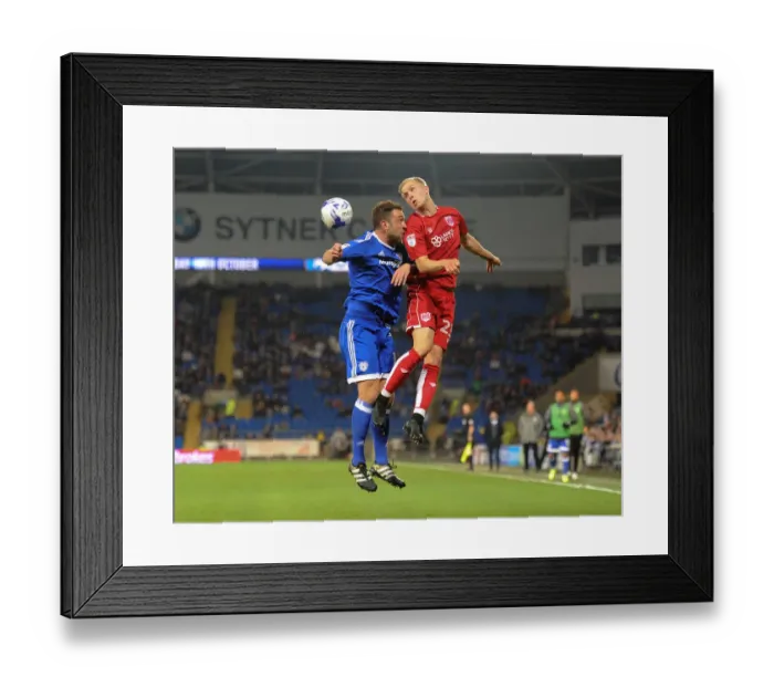 Framed Print : Battling for Supremacy: Hordur Magnusson vs. Rickie Lambert in Cardiff City vs. Bristol City Championship Clash
