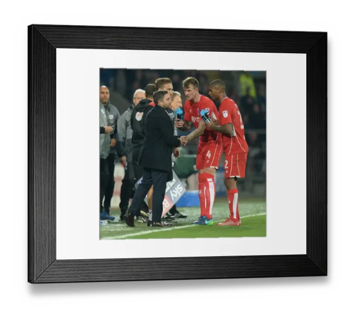 Framed Print : Bristol City: Johnson and Players in Deep Discussion during Cardiff Clash
