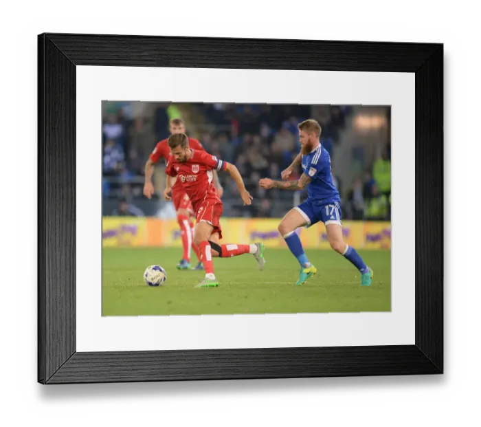 Framed Print : Gary O'Neil Charges Forward Amidst Aron Gunnarsson's Defensive Pressure - Cardiff City vs. Bristol City, Sky Bet Championship Framed Print : Gary O'Neil Charges Forward Amidst Aron Gunnarsson's Defensive Pressure - Cardiff City vs. Bristol City, Sky Bet Championship