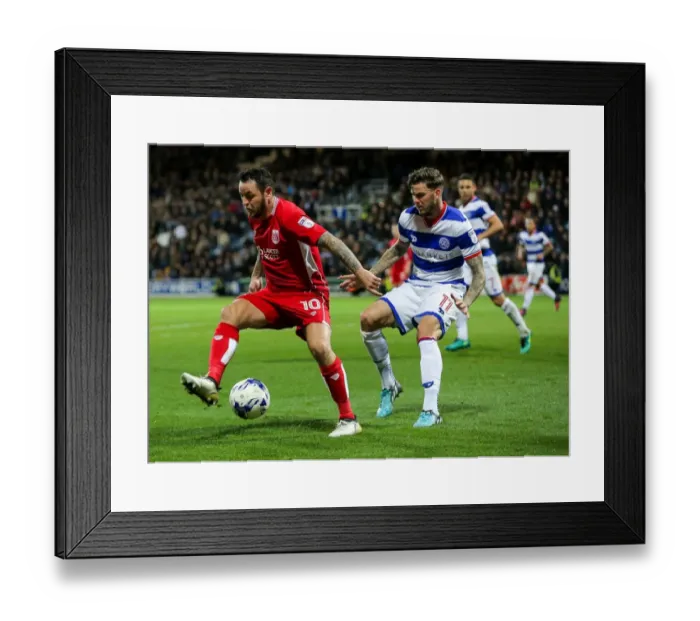 Framed Print : Clash at Loftus Road: Lee Tomlin vs Ben Gladwin in QPR vs Bristol City Championship Showdown