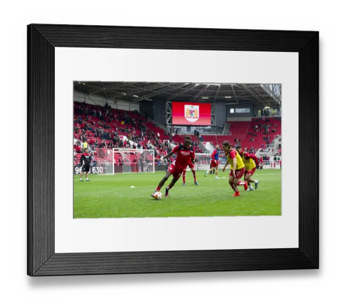 Framed Print : Bristol City Players Prepare for Battle against Blackburn Rovers at Ashton Gate Stadium